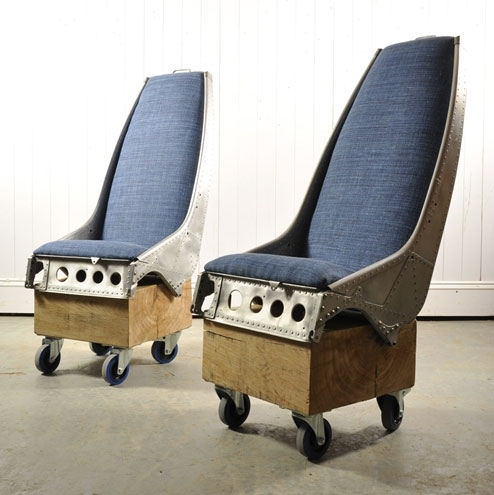 Two upcycled chairs made from Lynx Helicoper seats by Original House with blue upholstery.